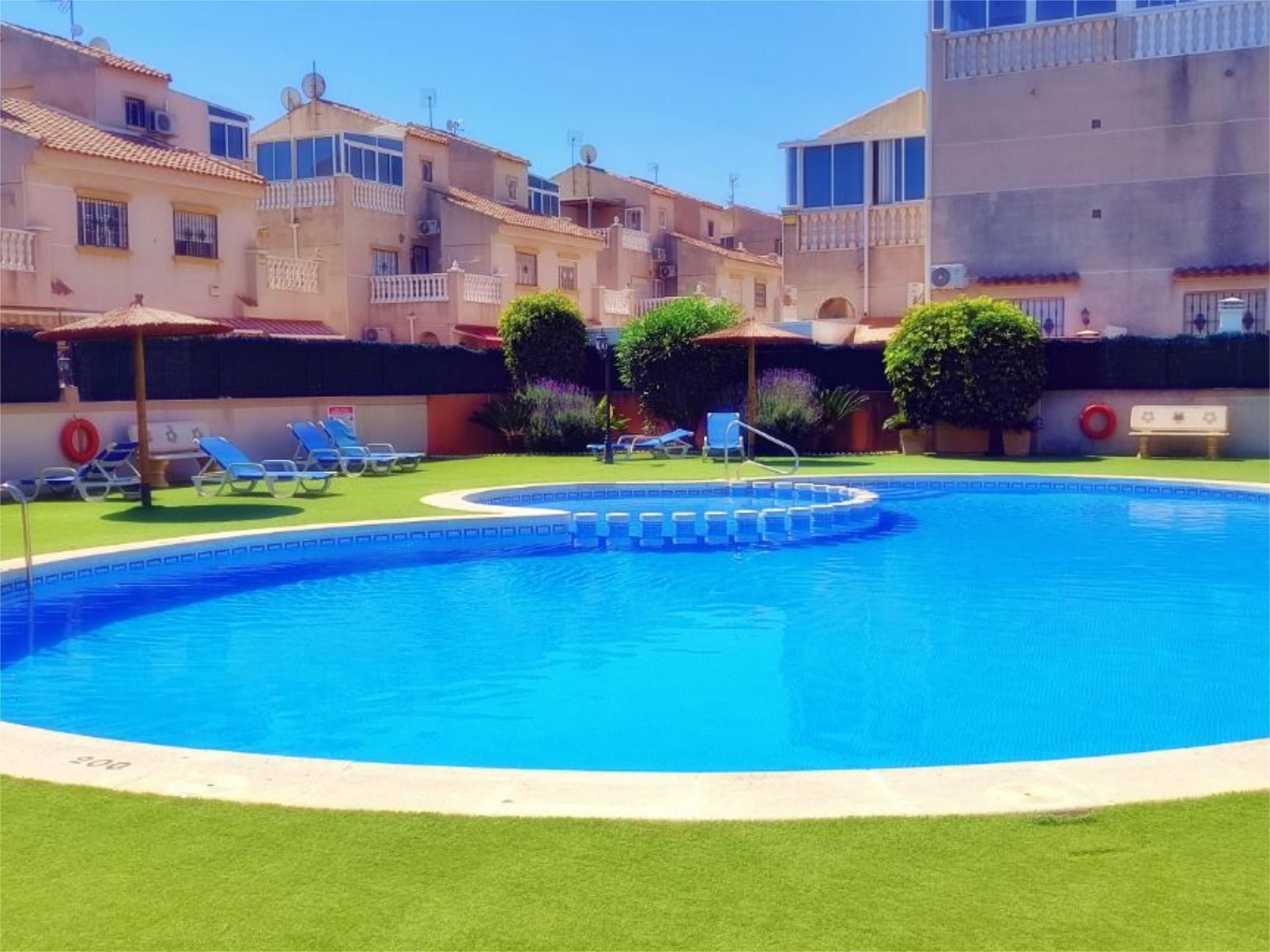 Swimming pool of Duplex for sale in Torrevieja  with Air Conditioner, Heating and Private garden