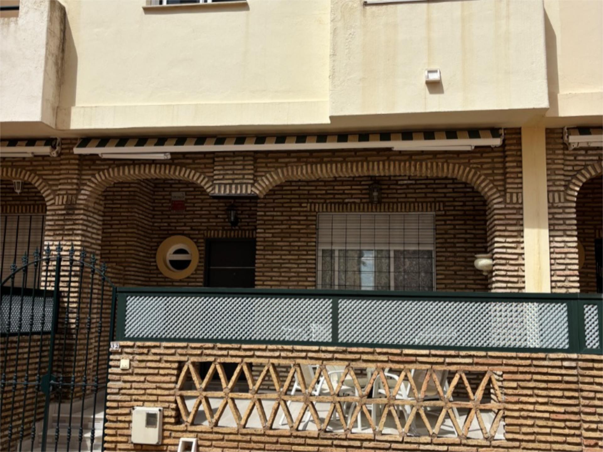 Vista exterior de Casa adosada en venda en La Antilla amb Terrassa, Traster i Piscina