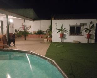 Swimming pool of Single-family semi-detached to share in Lora del Río  with Air Conditioner, Heating and Private garden