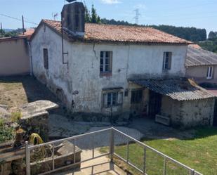 Vista exterior de Casa adosada en venda en Abegondo amb Jardí privat