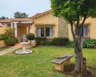 Jardí de Casa adosada de lloguer en Benalmádena amb Jardí privat i Moblat