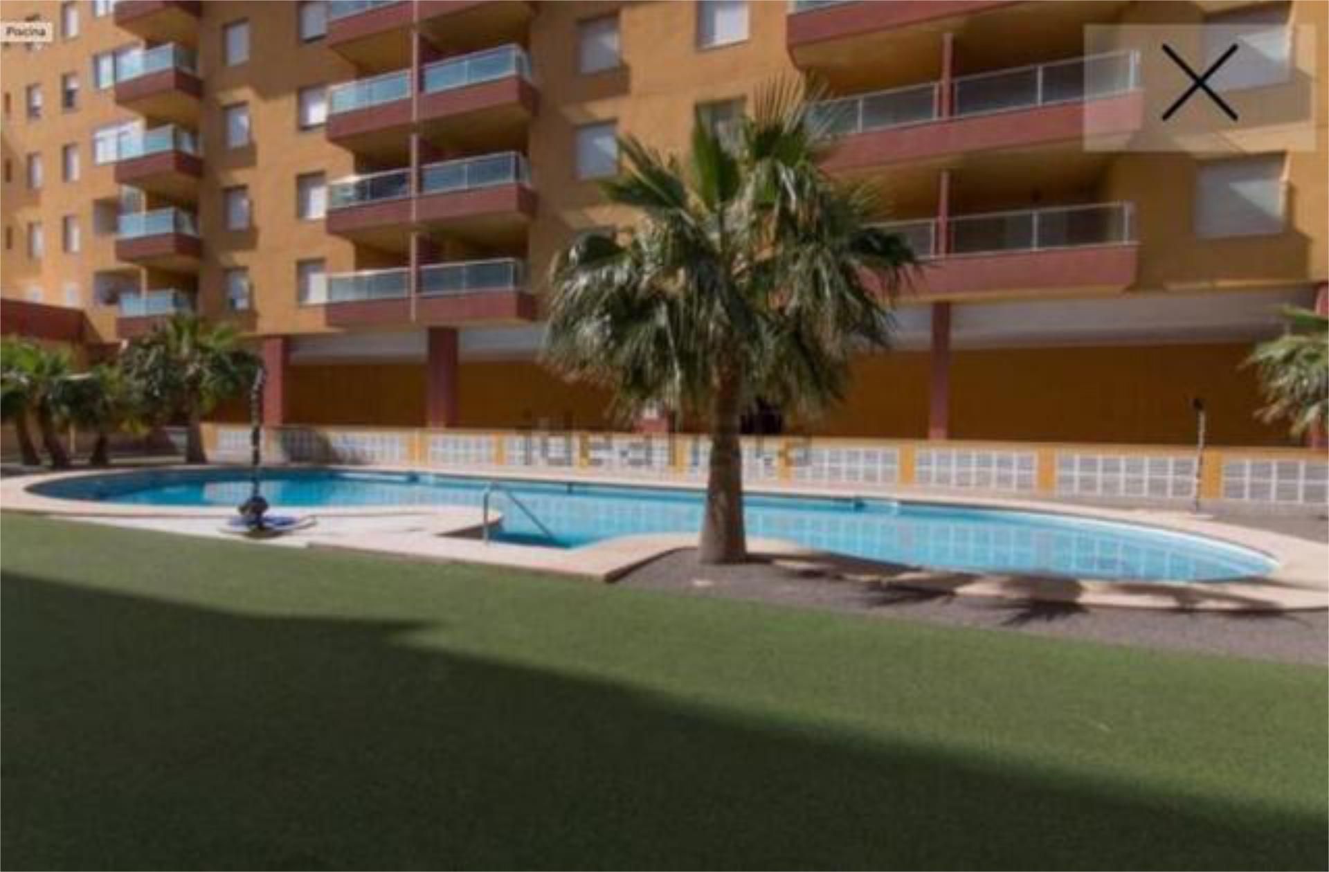 Piscina de Pis de lloguer en Roquetas de Mar amb Calefacció, Jardí privat i Terrassa