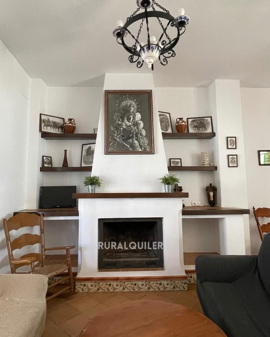 Sala de estar de Casa adosada en venta en Almonte con Aire acondicionado, Parquet y Terraza