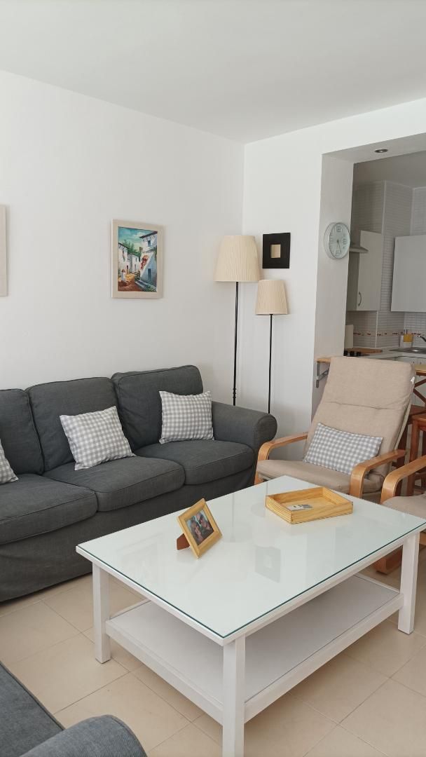 Sala d'estar de Pis de lloguer en Torremolinos amb Aire condicionat, Calefacció i Jardí privat