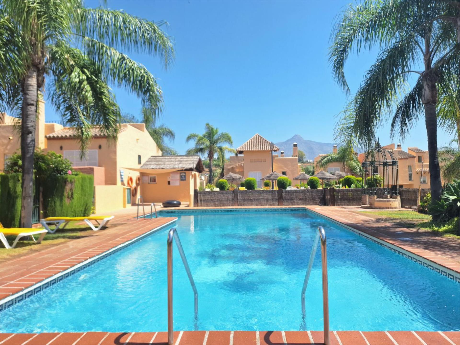 Exterior view of Single-family semi-detached for sale in Marbella  with Air Conditioner, Terrace and Swimming Pool