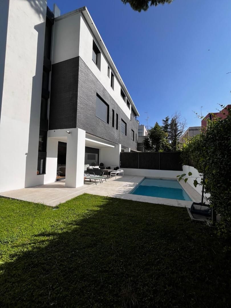 Swimming pool of Single-family semi-detached for sale in  Madrid Capital  with Alarm and Laundry room