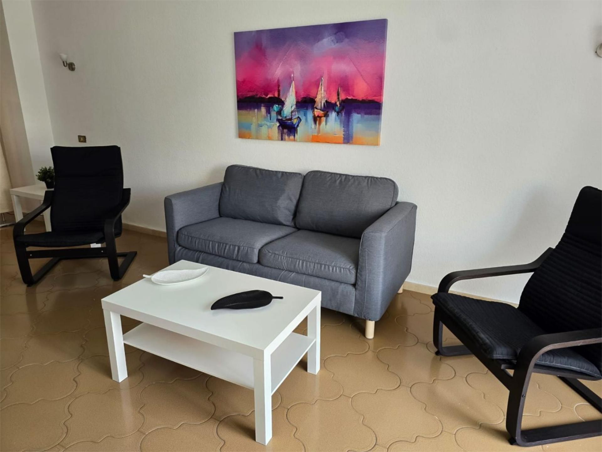 Sala d'estar de Pis de lloguer en Puerto de la Cruz amb Balcó
