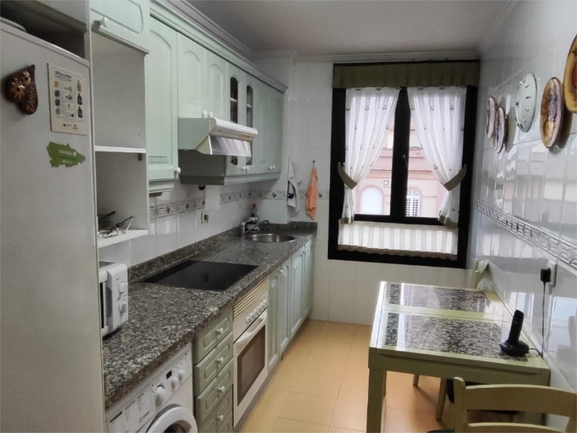 Kitchen of Flat for sale in Oviedo   with Heating, Parquet flooring and Storage room
