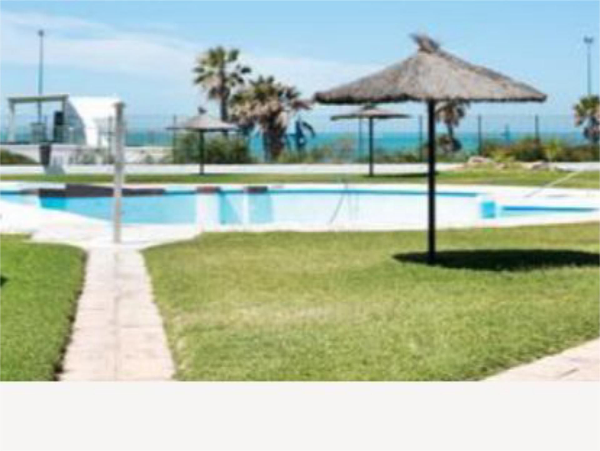 Piscina de Apartament de lloguer en Chiclana de la Frontera amb Jardí privat, Terrassa i Piscina