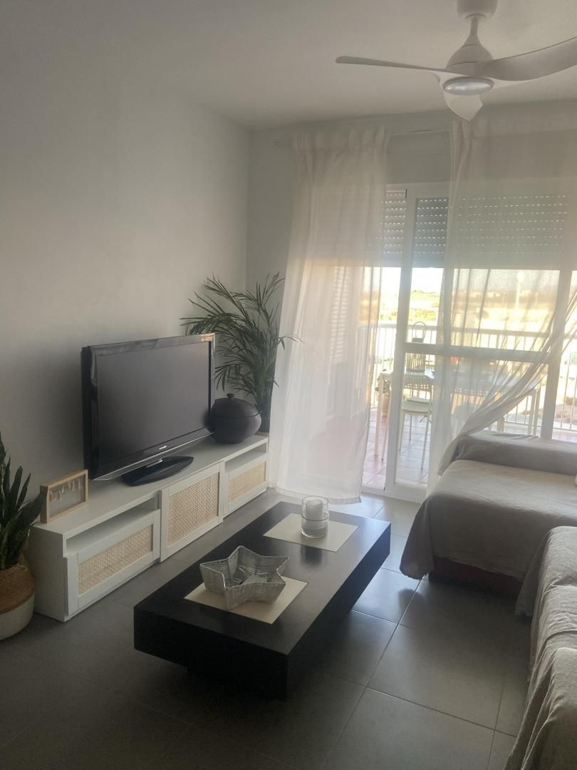 Living room of Flat to rent in Águilas  with Parquet flooring, Terrace and Swimming Pool