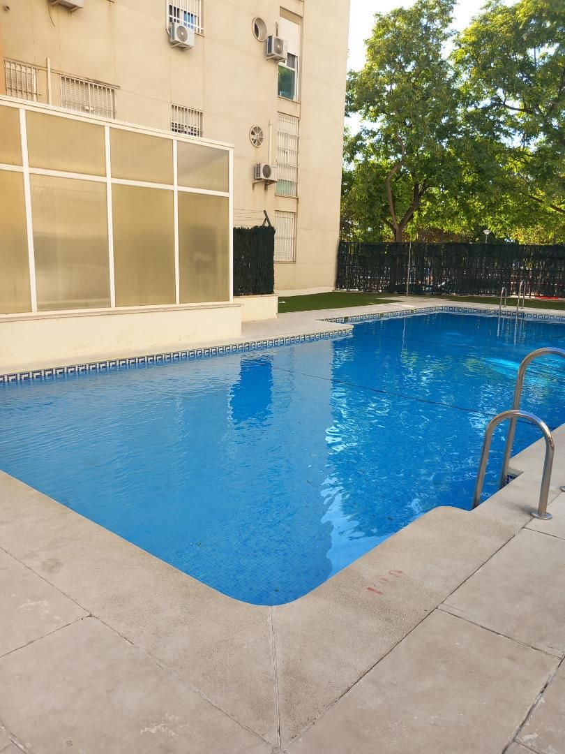 Swimming pool of Flat for sale in  Sevilla Capital  with Air Conditioner, Furnished and Oven