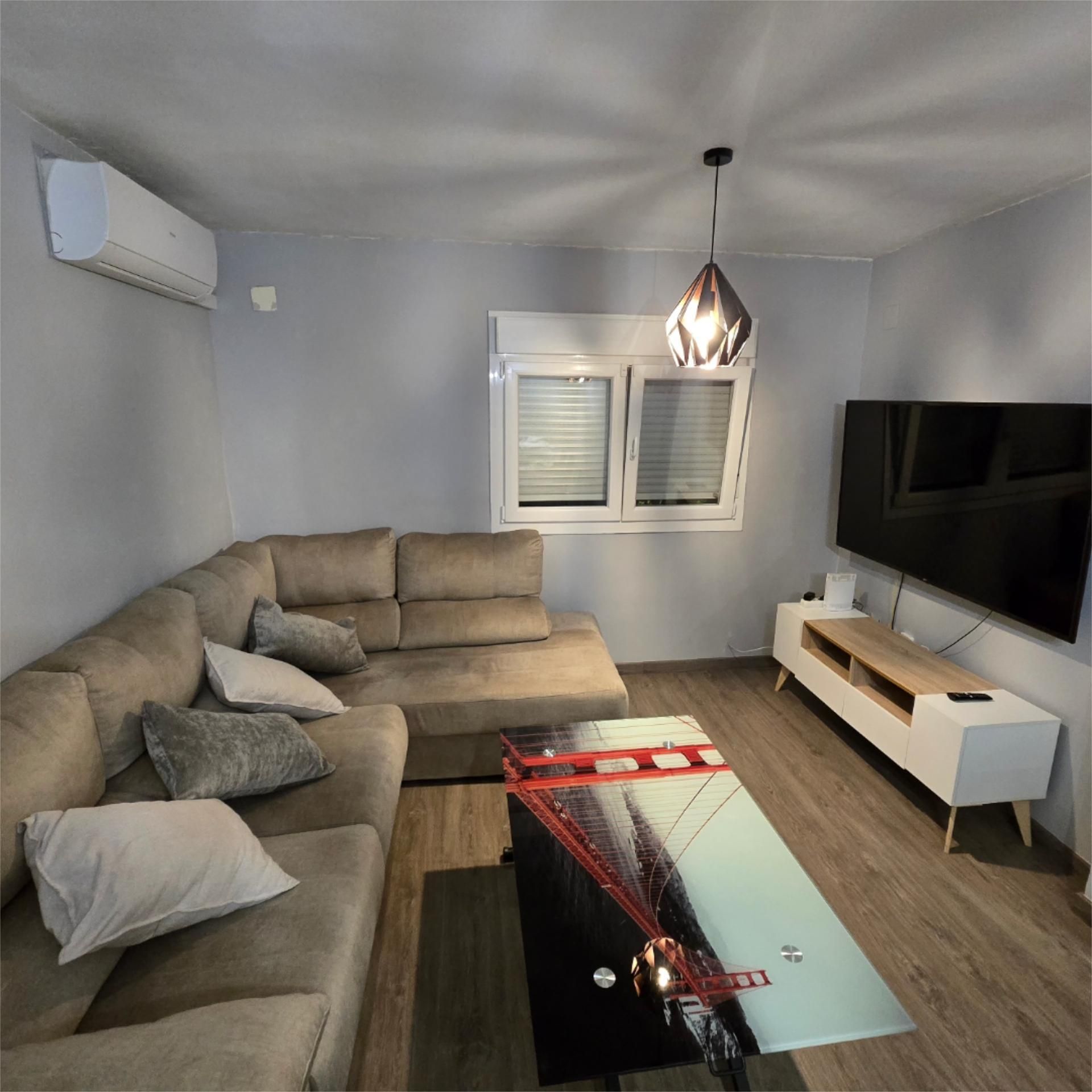 Living room of Flat to rent in Dos Hermanas  with Air Conditioner, Parquet flooring and Furnished