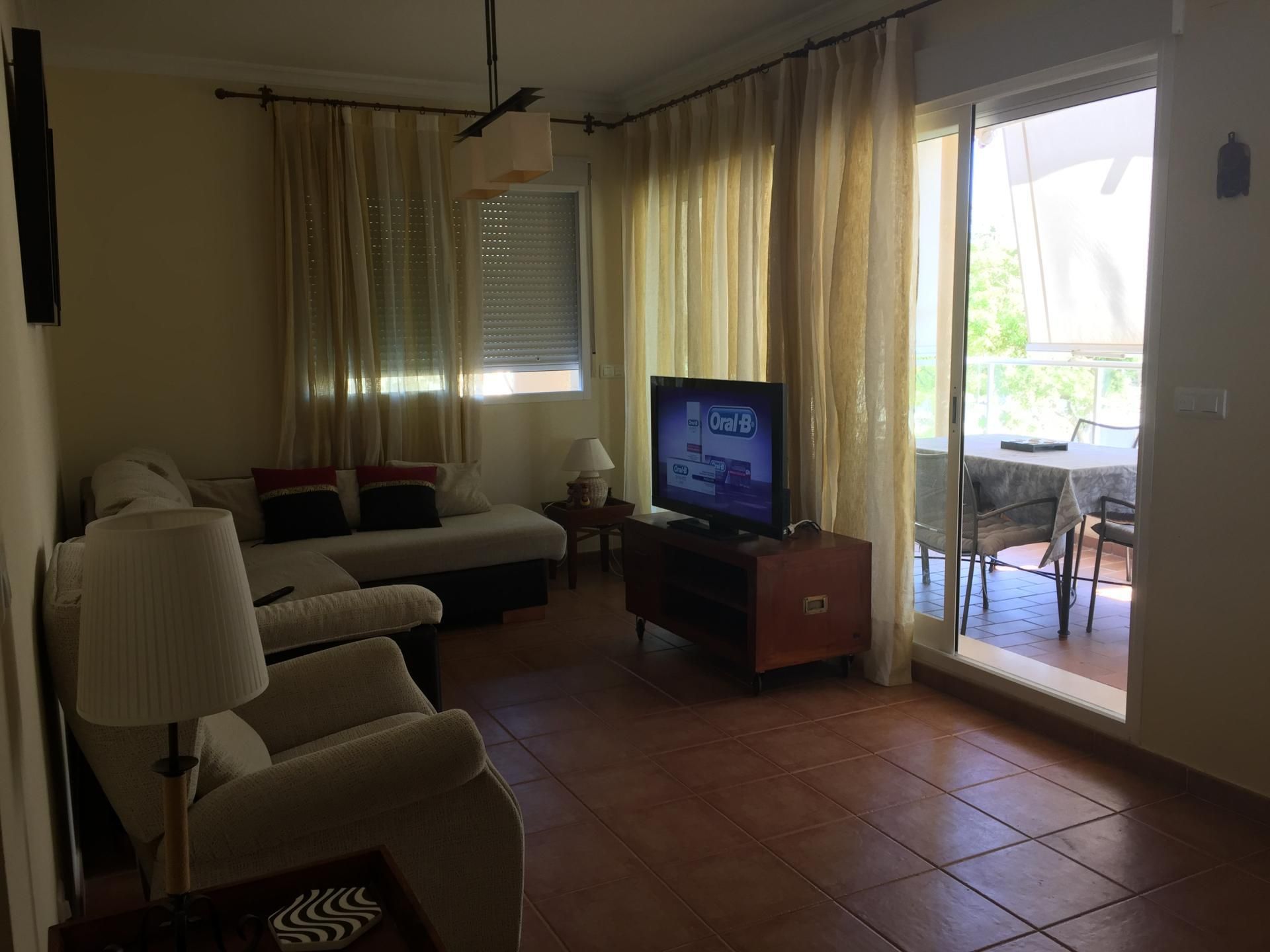 Living room of Flat for sale in La Antilla  with Private garden, Terrace and Storage room