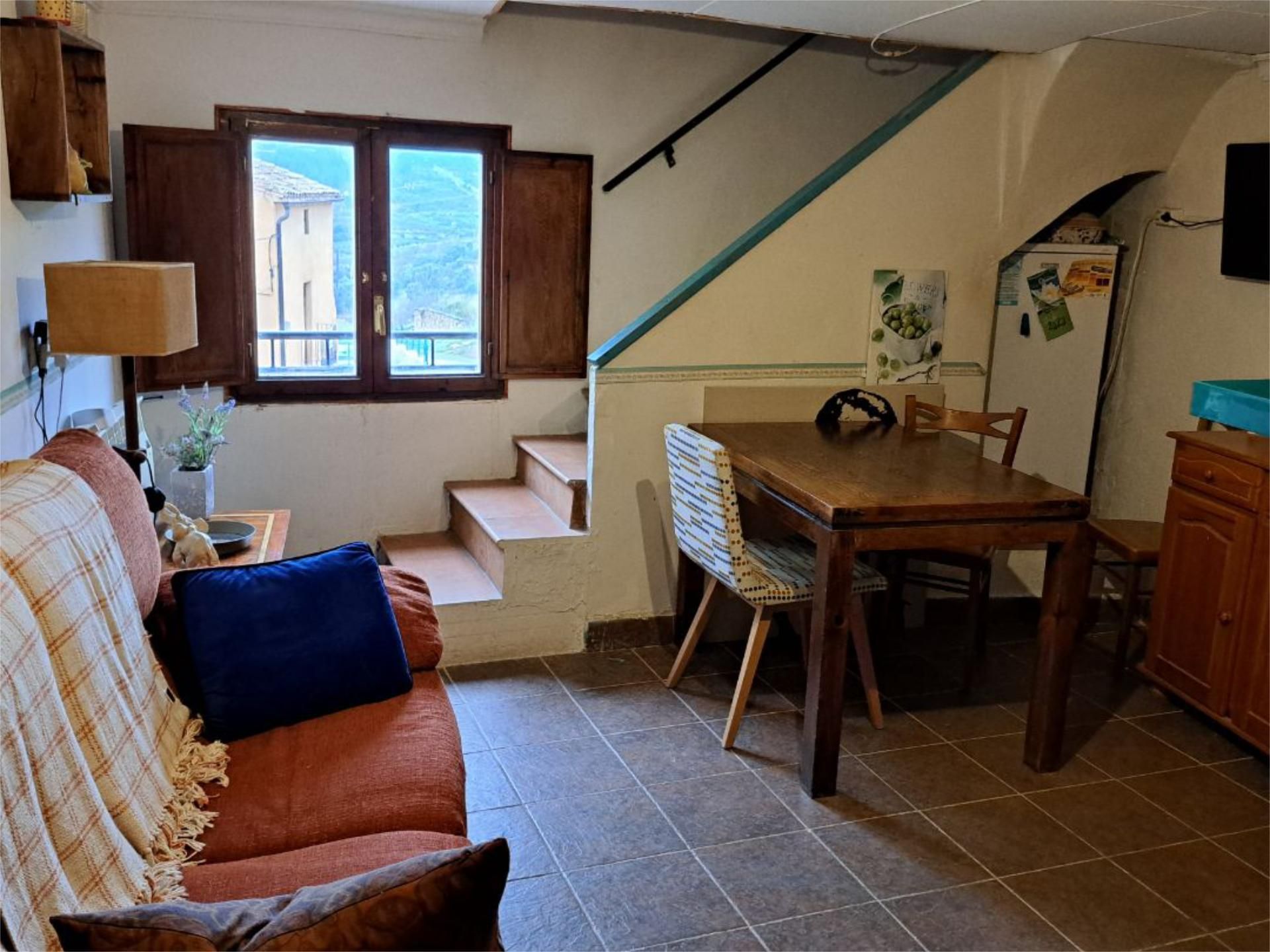 Sala d'estar de Casa adosada en venda en Prat de Comte amb Traster i Moblat