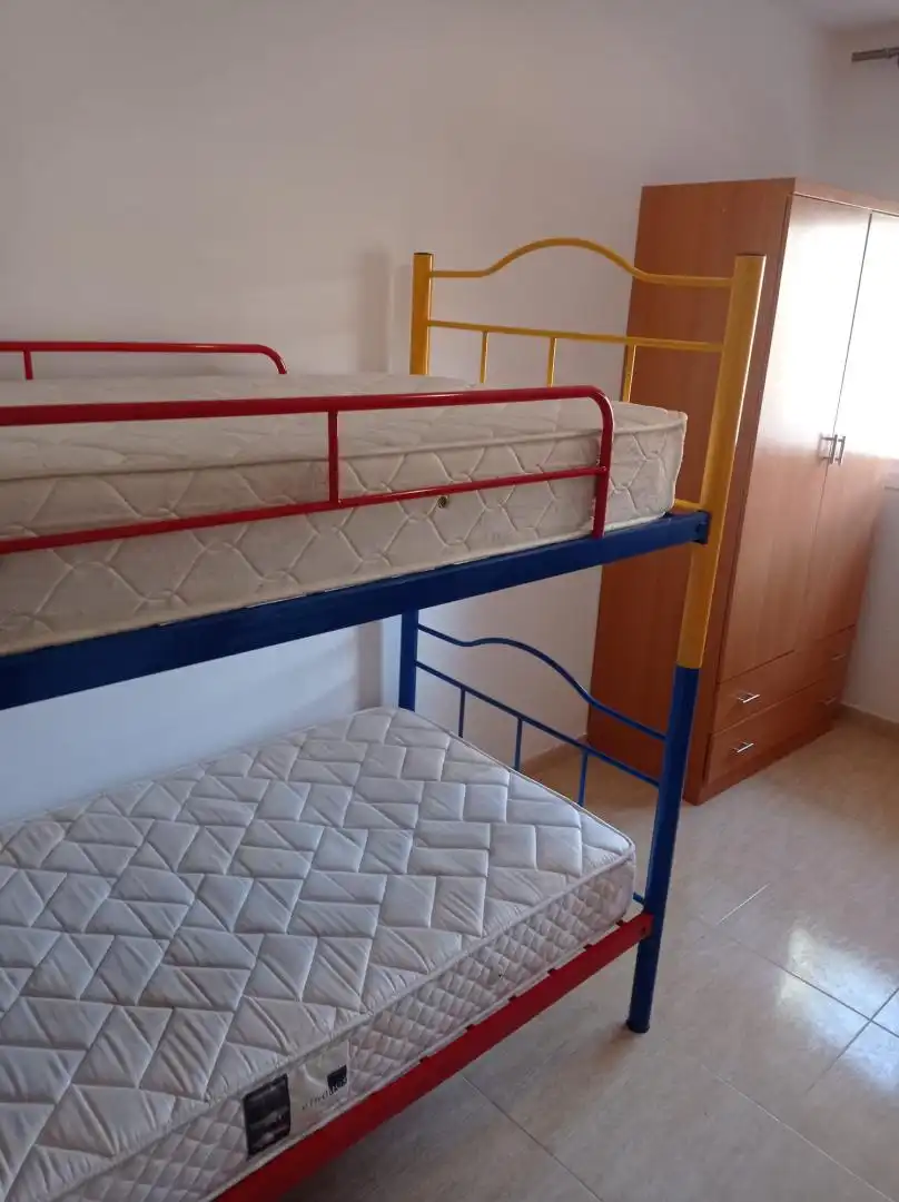 Pis en venda a Carrer Castell de Tamarit, 15, Els Tallats - Mas Olivé Dormitori de Pis en venda en Cambrils amb Aire condicionat, Terrassa i Piscina