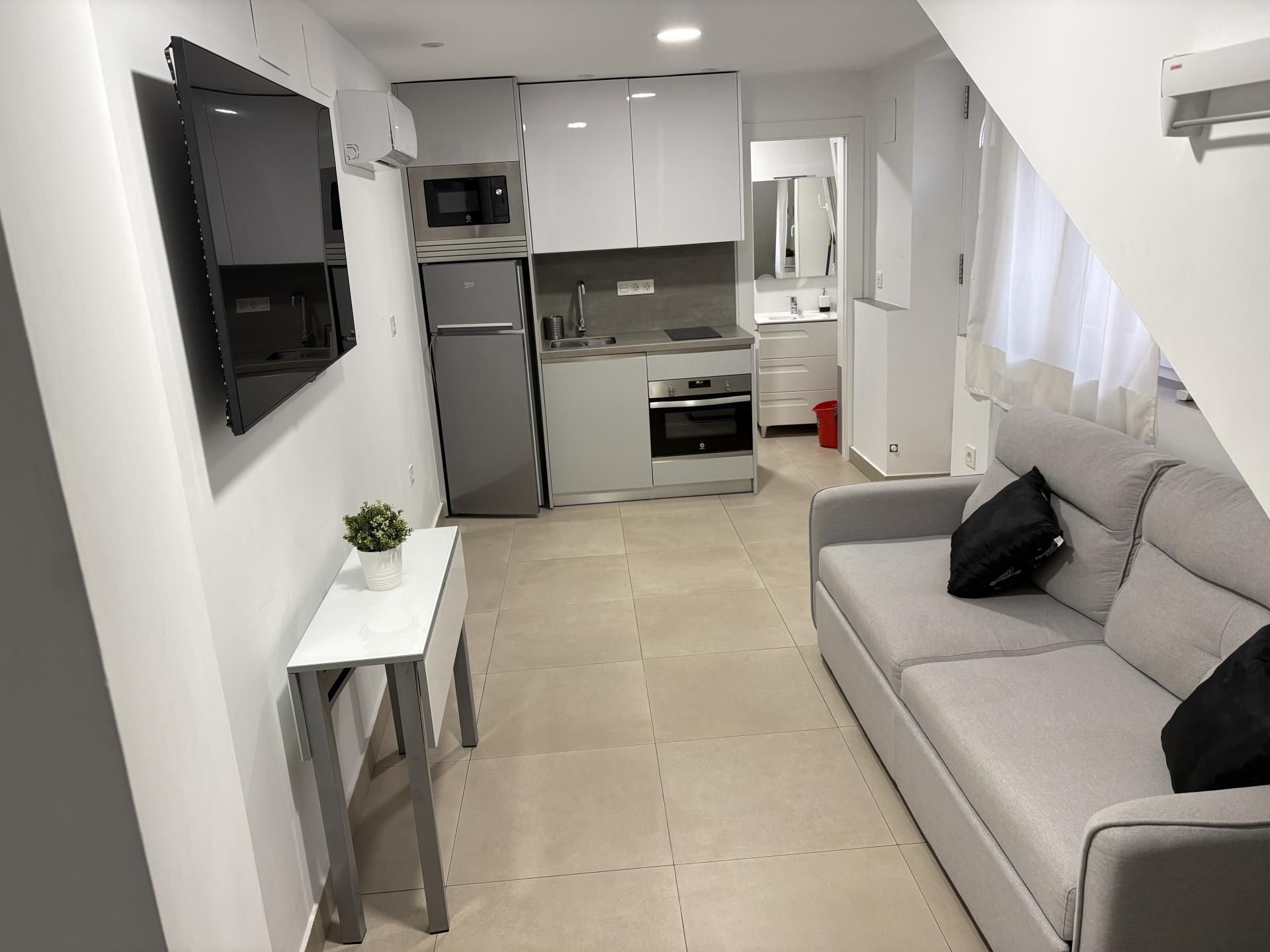 Pis de lloguer a Calle del Agua, 13, Dílar Sala d'estar de Pis de lloguer en Dílar amb Aire condicionat i Moblat