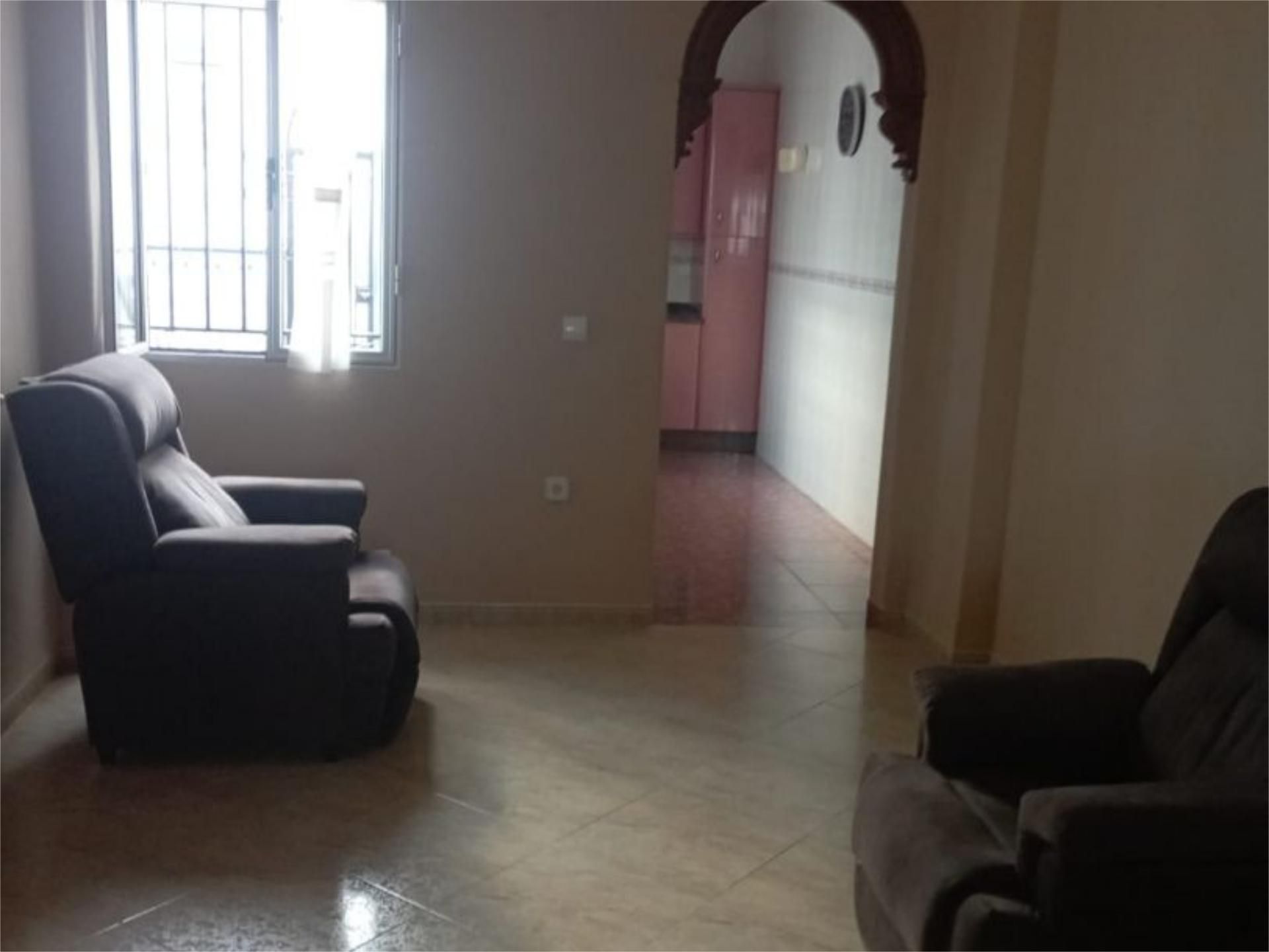 Sala d'estar de Casa adosada en venda en Osuna amb Aire condicionat i Terrassa