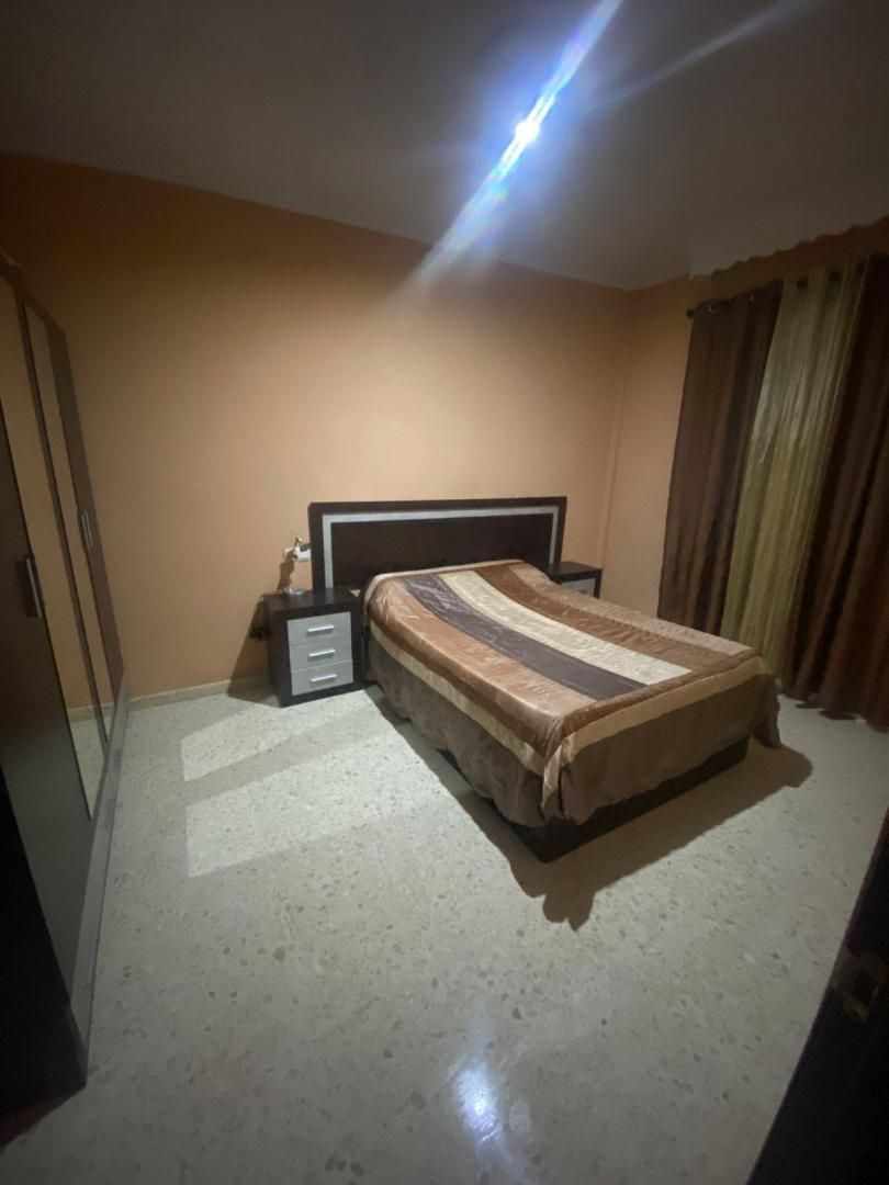 Dúplex de lloguer a Calle Málaga, 28, Puente Genil Dormitori de Dúplex de lloguer en Puente Genil amb Aire condicionat, Terrassa i Moblat