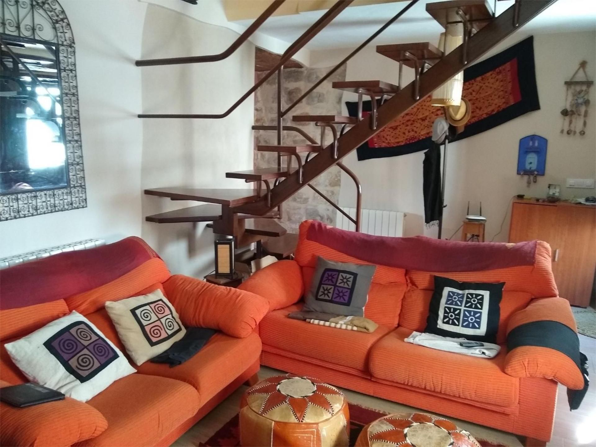 Sala de estar de Casa adosada en venta en Baeza con Calefacción, Jardín privado y Terraza