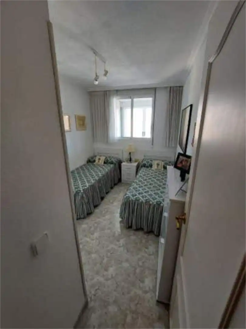 Apartamento en venta en Colonia Madrid Habitación de Apartamento en venta en Benidorm con Jardín privado, Terraza y Piscina