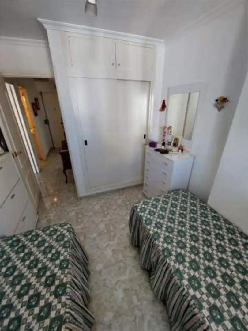 Apartamento en venta en Colonia Madrid Habitación de Apartamento en venta en Benidorm con Jardín privado, Terraza y Piscina