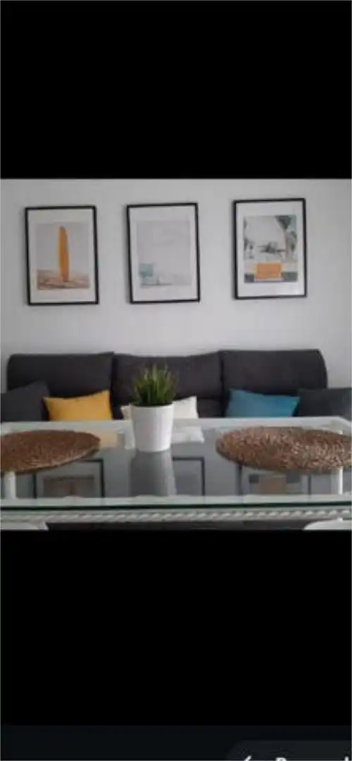 Piso de alquiler en Aguadulce - Almadraba - Punta Candor Sala de estar de Piso de alquiler en Rota con Terraza, Piscina y Amueblado