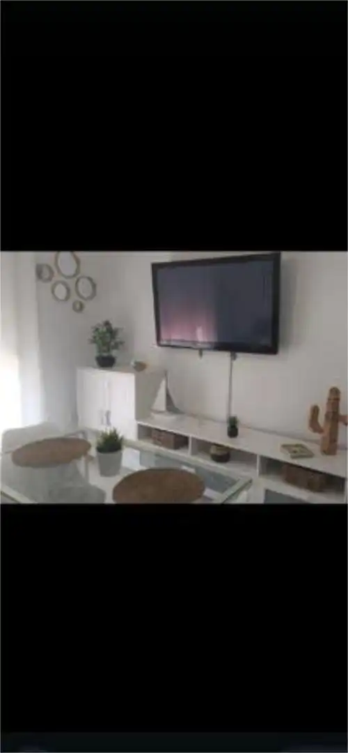 Piso de alquiler en Aguadulce - Almadraba - Punta Candor Sala de estar de Piso de alquiler en Rota con Terraza, Piscina y Amueblado