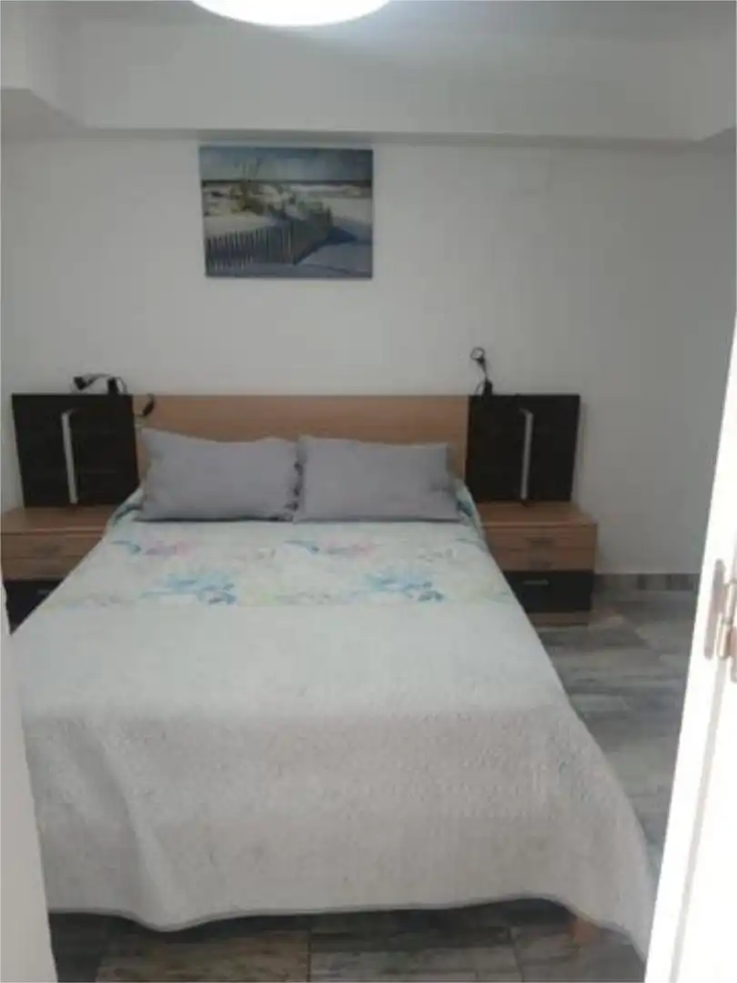 Dormitori de Apartament de lloguer en Almonte amb Jardí privat i Piscina