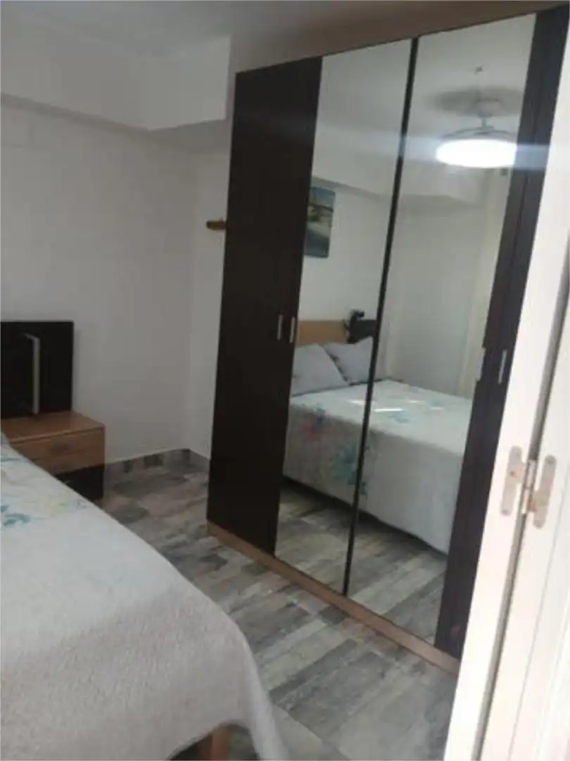 Dormitori de Apartament de lloguer en Almonte amb Jardí privat i Piscina