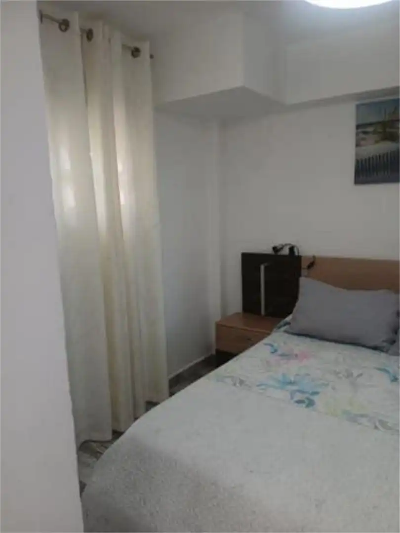 Dormitori de Apartament de lloguer en Almonte amb Jardí privat i Piscina