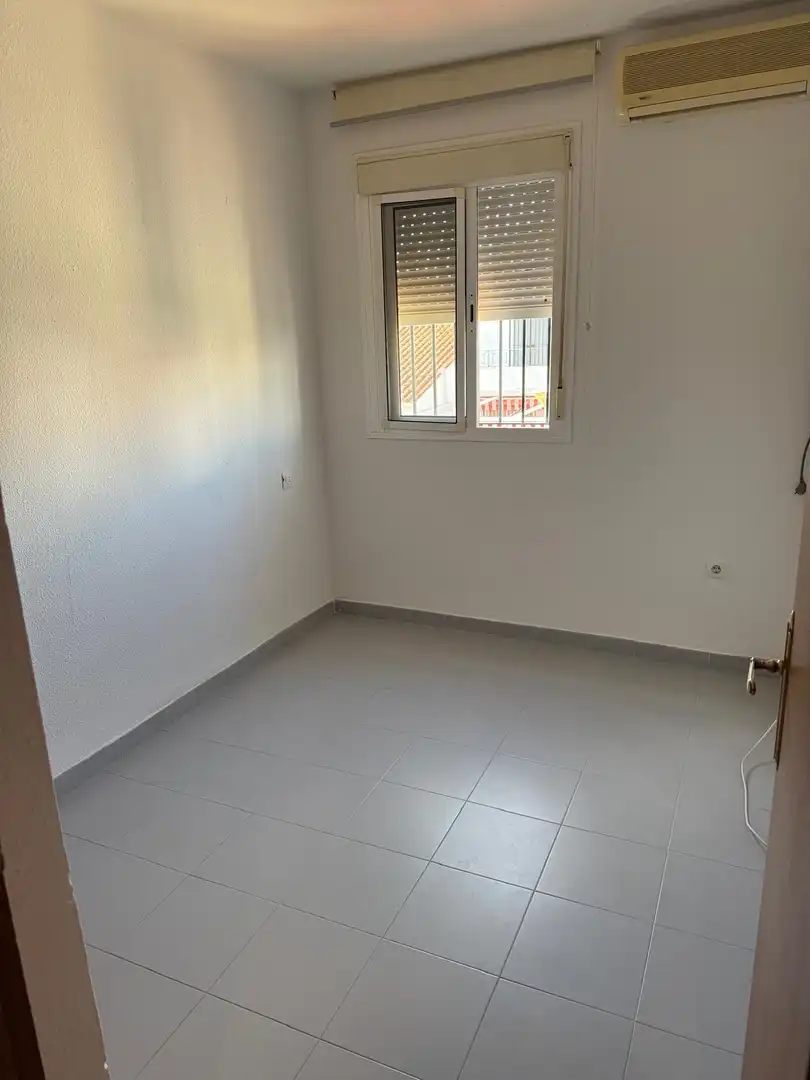 Casa adosada en venda a Calle Olivo, 2, El Portil Dormitori de Casa adosada en venda en El Portil amb Aire condicionat i Terrassa