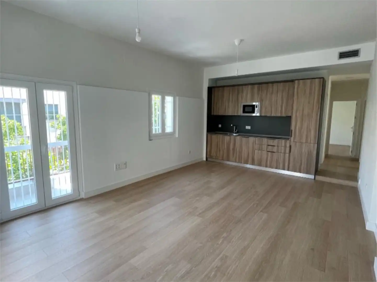Piso de alquiler en El Cerro Sala de estar de Piso de alquiler en Sevilla con Aire acondicionado, Calefacción y Parquet