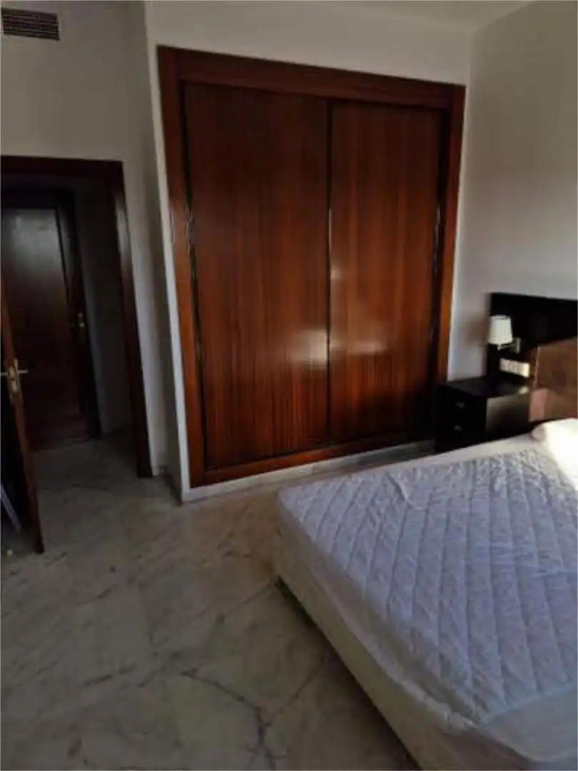 Schlafzimmer von Wohnung zum Verkauf in Bormujos mit Heizung, Privatgarten und Schwimmbad