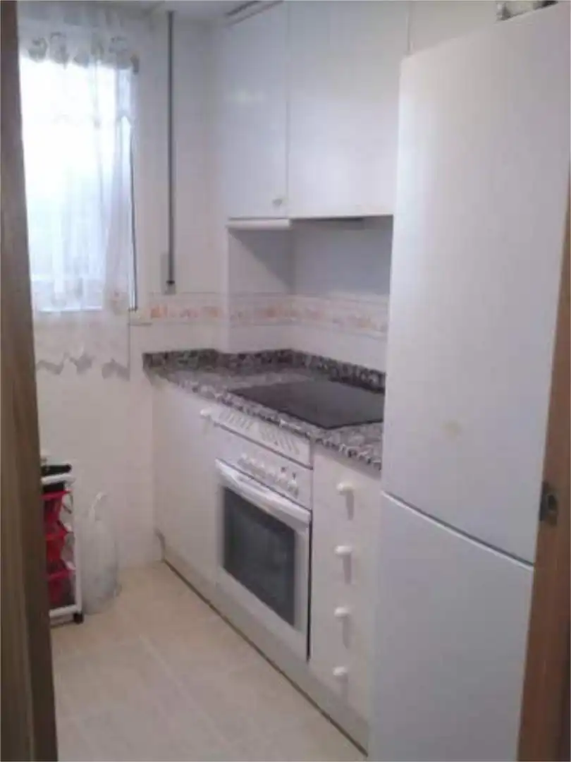 Apartamento de alquiler en Daimús Cocina de Apartamento de alquiler en Daimús con Jardín privado, Terraza y Piscina