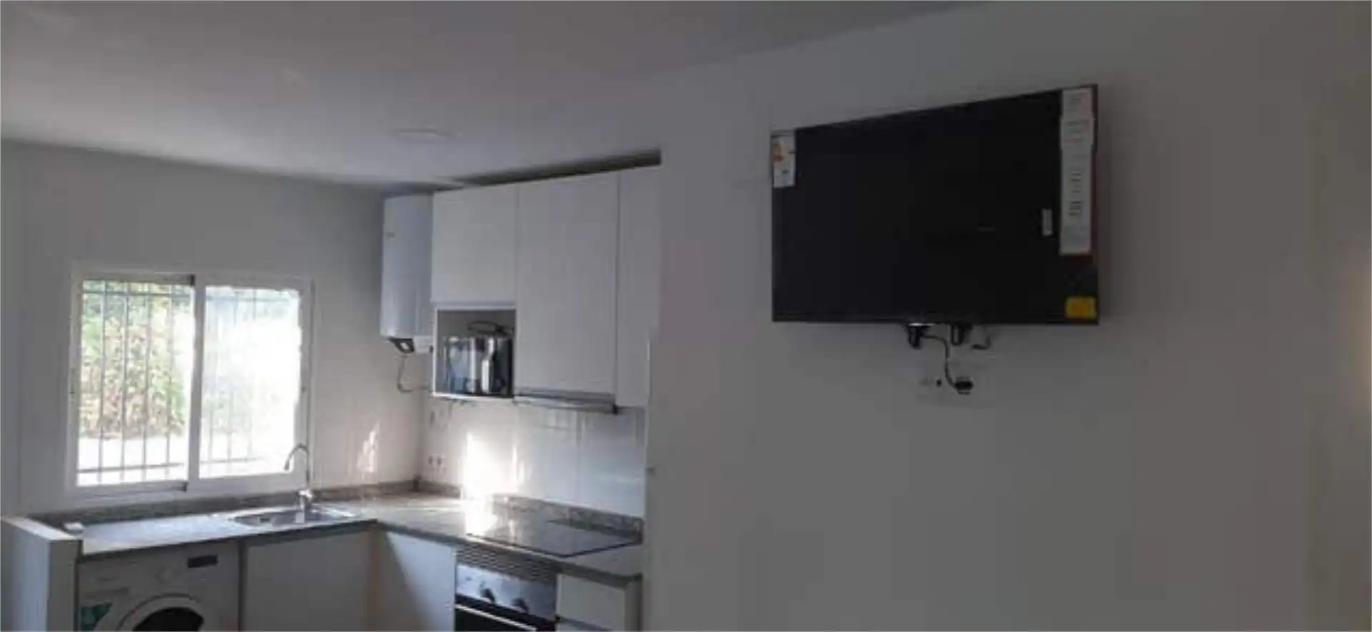 Cuina de Apartament de lloguer en Benicasim / Benicàssim amb Jardí privat i Moblat