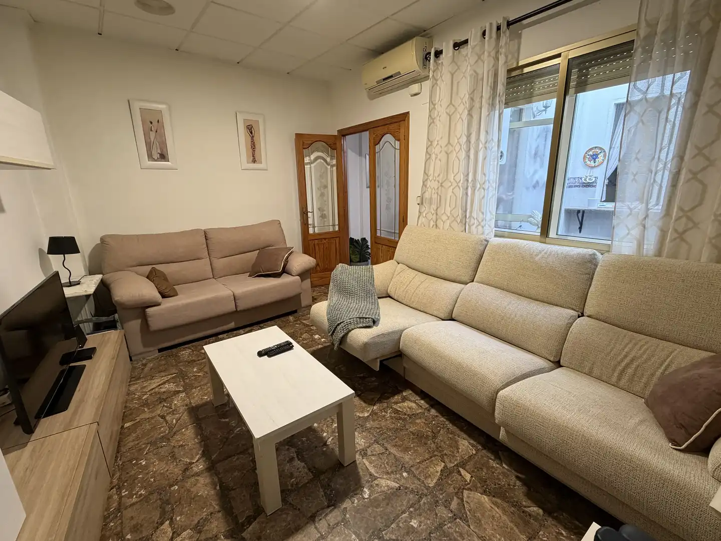 Casa adosada en venta en Carrer Sant Francesc, 30, Bellreguard Sala de estar de Casa adosada en venta en Bellreguard con Aire acondicionado y Terraza