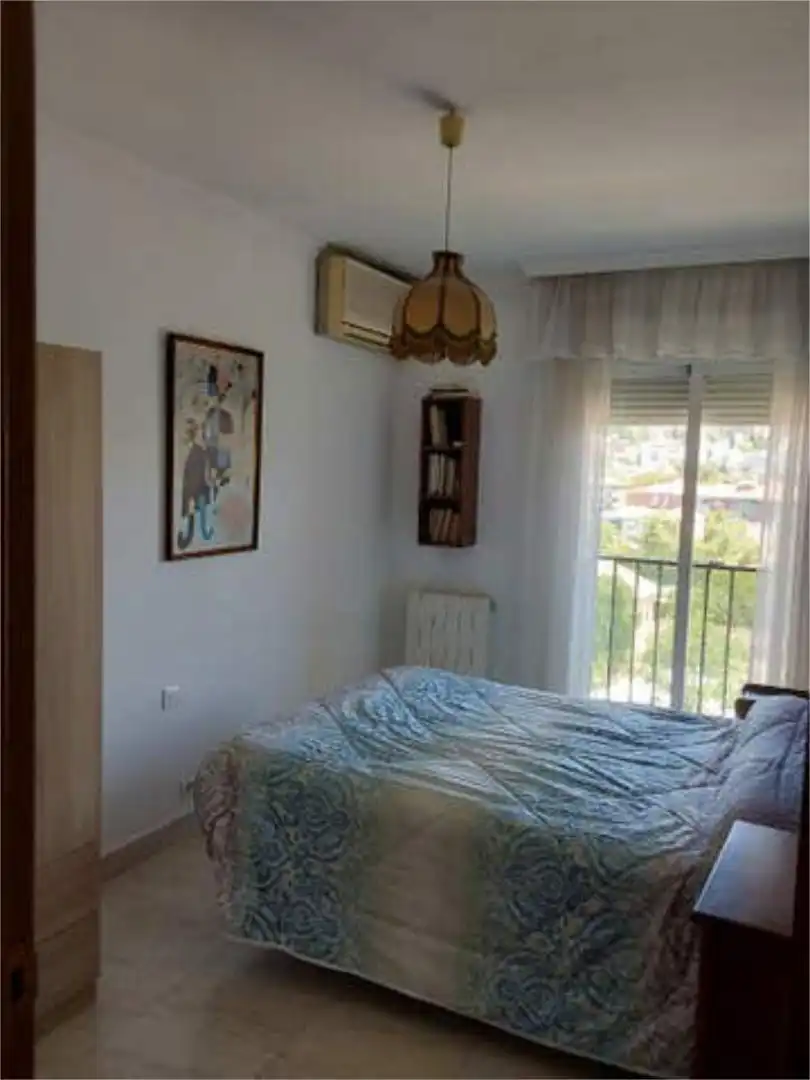 Wohnung zur Miete in Cervantes Schlafzimmer von Wohnung zur Miete in Granada mit Heizung, Privatgarten und Terrasse