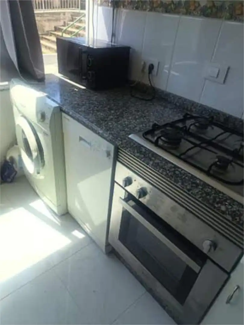 Cuina de Apartament de lloguer en Leiro amb Jardí privat i Traster