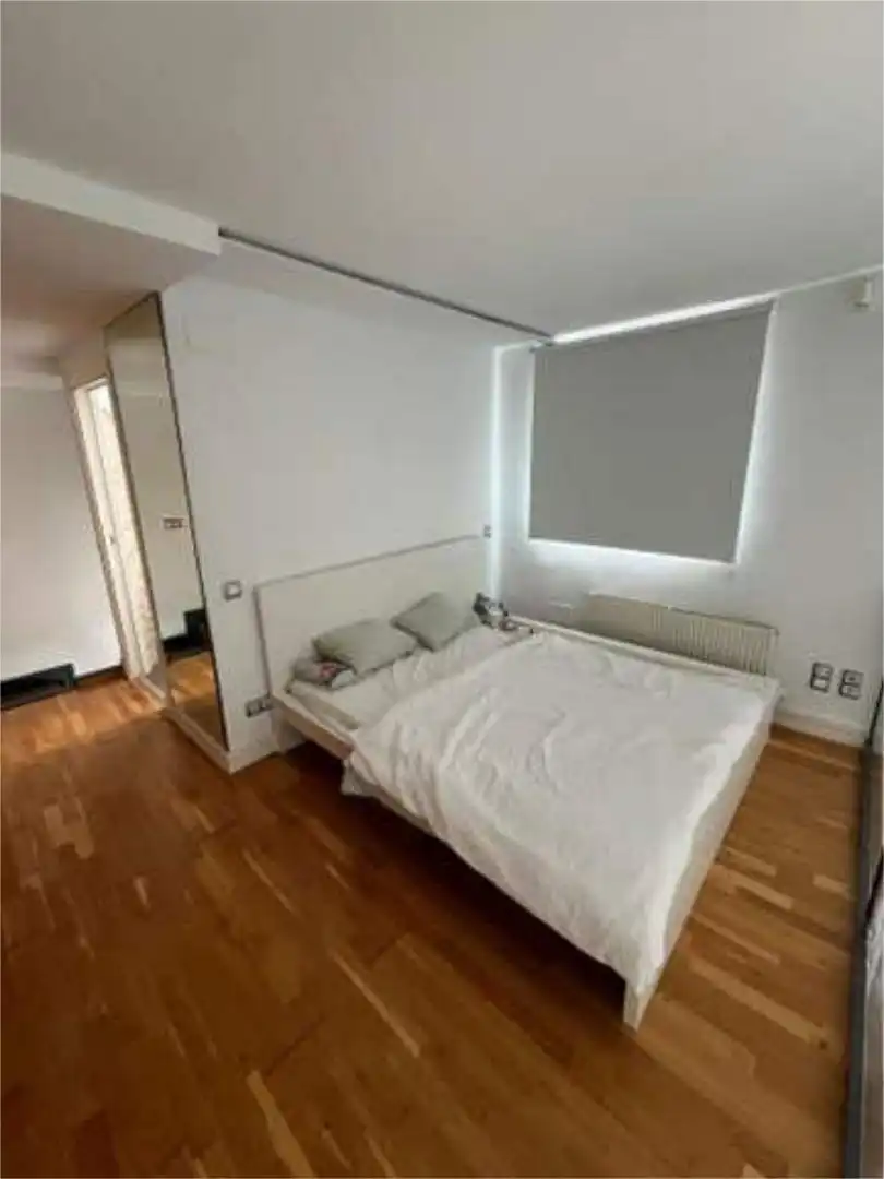 Loft de lloguer a Guindalera Dormitori de Loft de lloguer en Madrid amb Calefacció, Jardí privat i Piscina