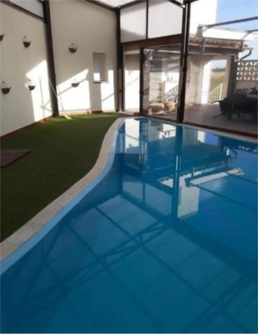 Einfamilien-Reihenhaus zum Verkauf in Ossa de Montiel Schwimmbecken von Einfamilien-Reihenhaus zum Verkauf in Ossa de Montiel mit Heizung, Privatgarten und Terrasse