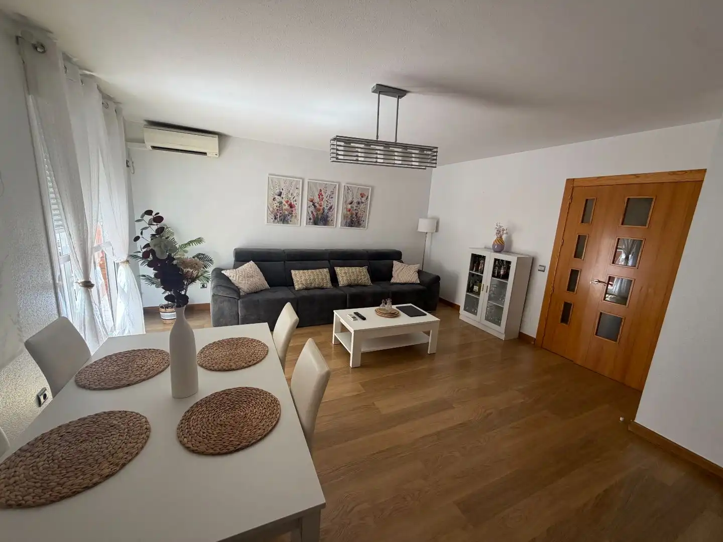 Living room of Duplexes for sale in Almería  with Air Conditioner, Parquet flooring and Storage room