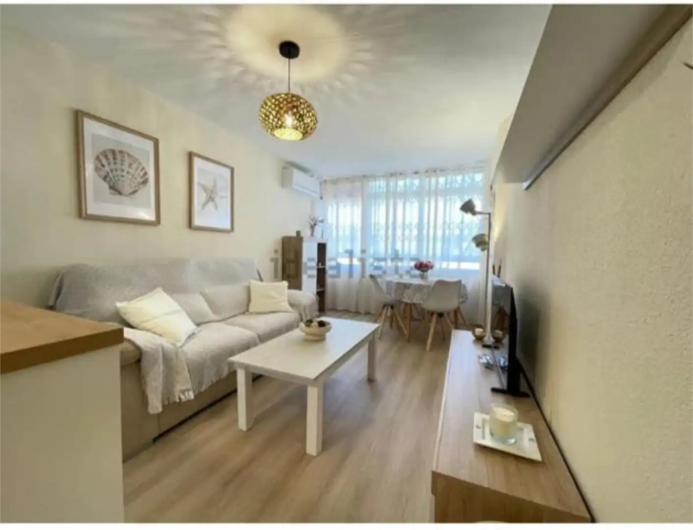 Pis de lloguer a Mil Palmeras Sala d'estar de Pis de lloguer en Pilar de la Horadada amb Piscina