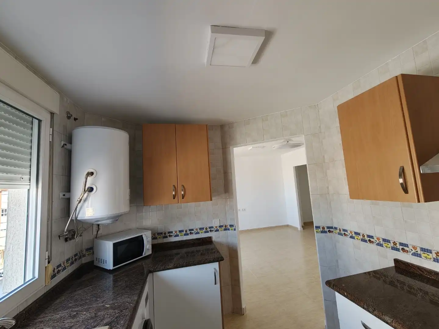Wohnung zur Miete in Carrer Valencia, 23, L'Olleria Küche von Wohnung zur Miete in L'Olleria mit Ofen, Waschmaschine und Mikrowelle