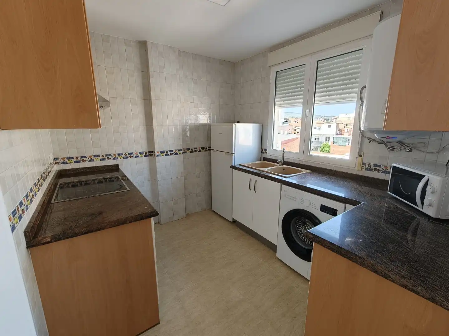 Wohnung zur Miete in Carrer Valencia, 23, L'Olleria Küche von Wohnung zur Miete in L'Olleria mit Ofen, Waschmaschine und Mikrowelle