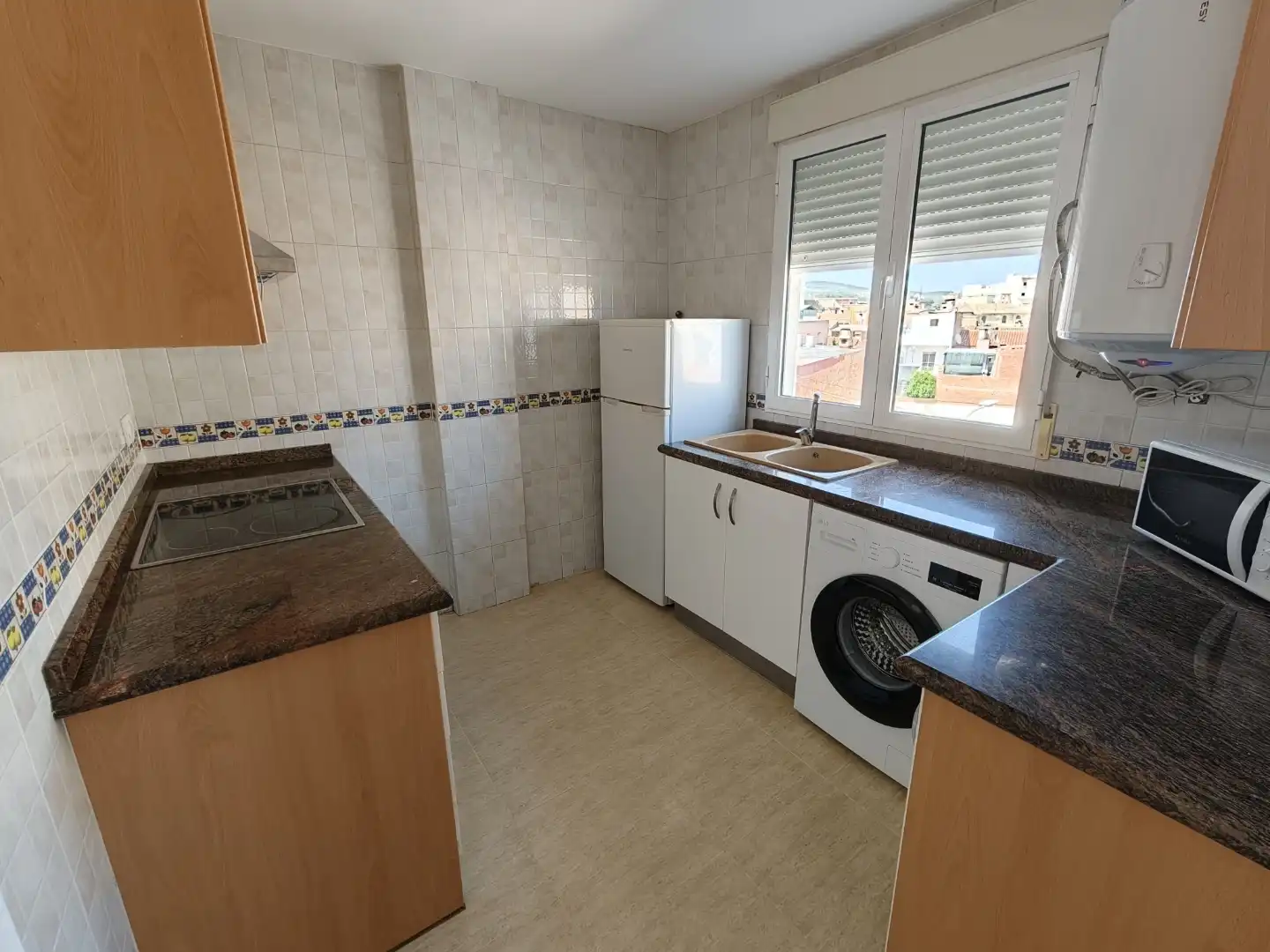 Wohnung zur Miete in Carrer Valencia, 23, L'Olleria Küche von Wohnung zur Miete in L'Olleria mit Ofen, Waschmaschine und Mikrowelle
