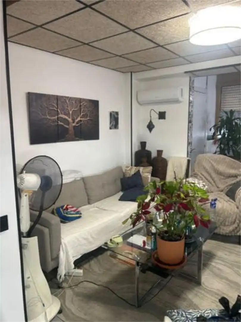 Apartamento de alquiler en Sierra Helada Sala de estar de Apartamento de alquiler en Benidorm con Jardín privado, Piscina y Amueblado