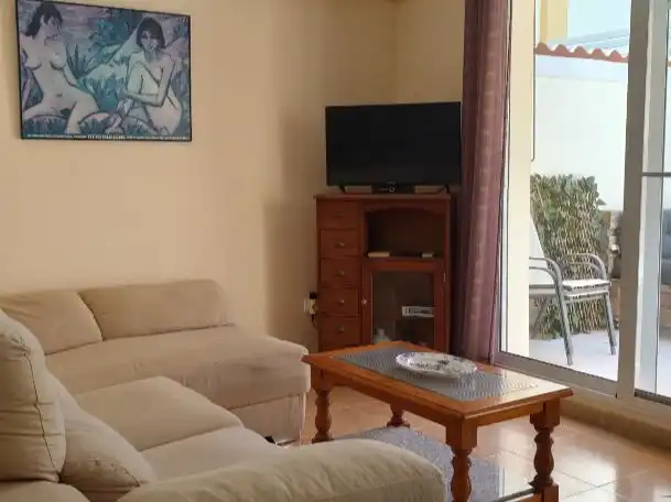 Dúplex de alquiler en Avenida Tortuga Boba, 5, Vera Playa Naturista Sala de estar de Dúplex de alquiler en Vera con Aire acondicionado, Jardín privado y Terraza