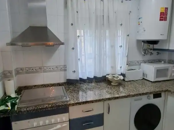 Casa adosada en venda a Calle Osa Mayor, 1, Salobreña Costa Cuina de Casa adosada en venda en Salobreña amb Aire condicionat, Piscina i Moblat