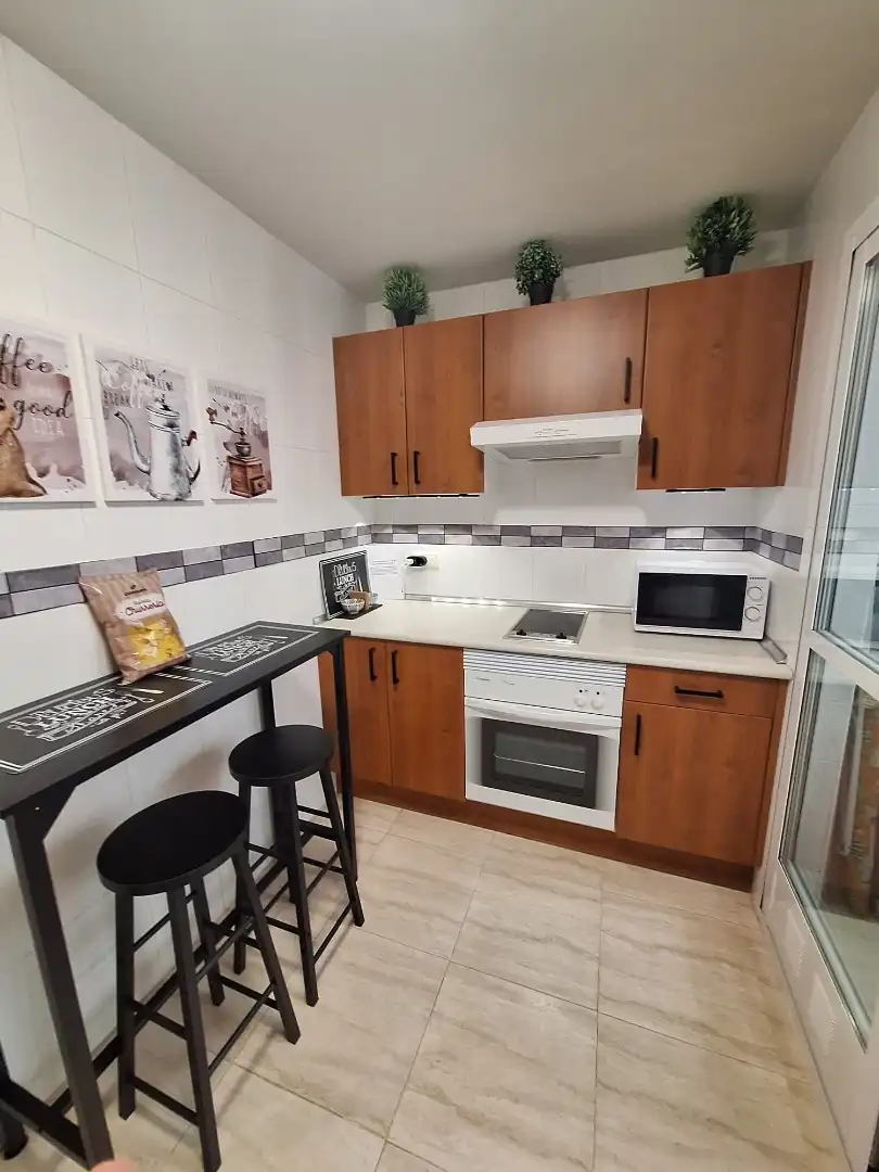 Apartament de lloguer a Calle Cabina, 19, Almerimar Cuina de Apartament de lloguer en El Ejido amb Aire condicionat, Calefacció i Jardí privat