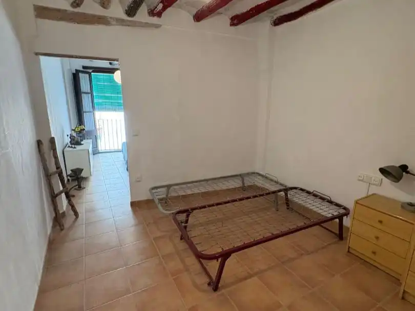 Casa adosada en venda a Carrer les Voltes, 14, Riba-roja d'Ebre Dormitori de Casa adosada en venda en Riba-roja d'Ebre amb Terrassa i Traster